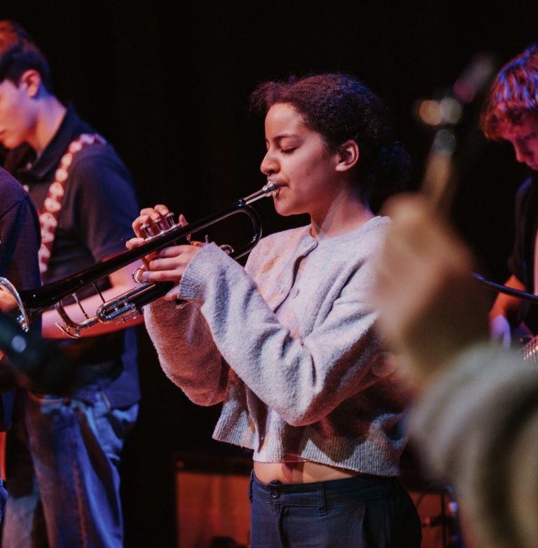 Angeline playing trumpet in ensemble setting