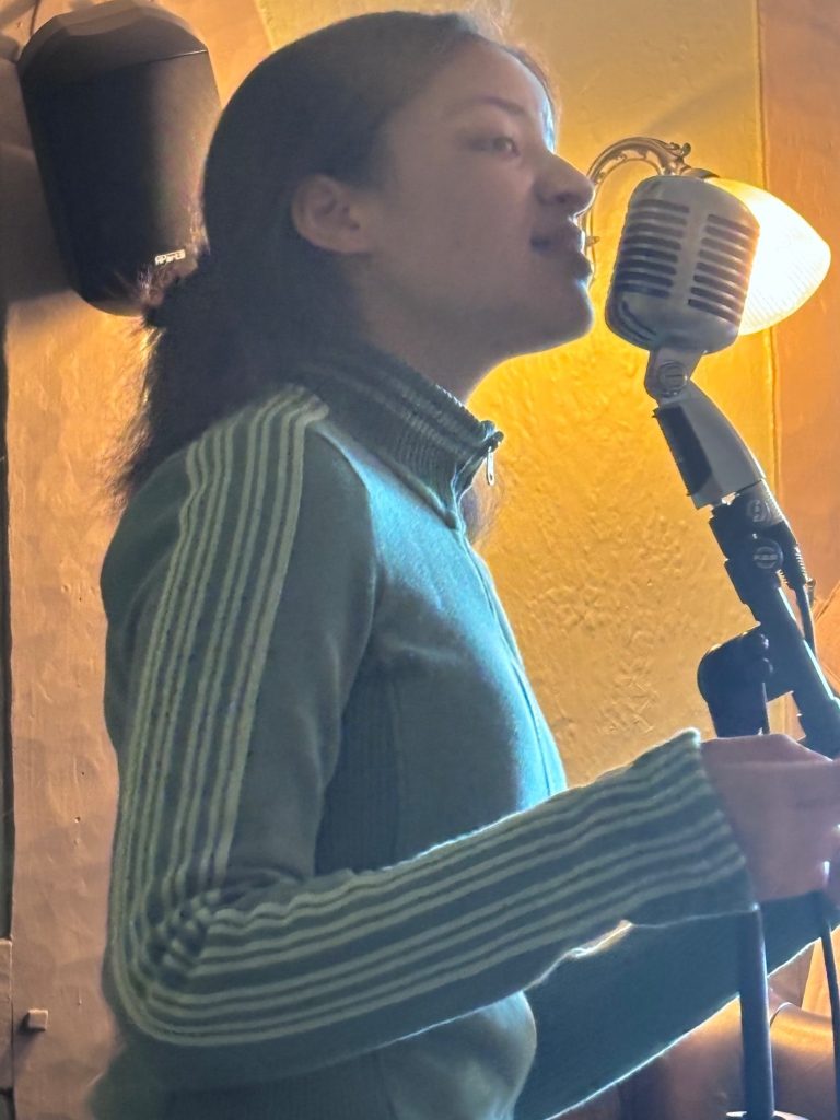 Angeline performing vocals live in Derby